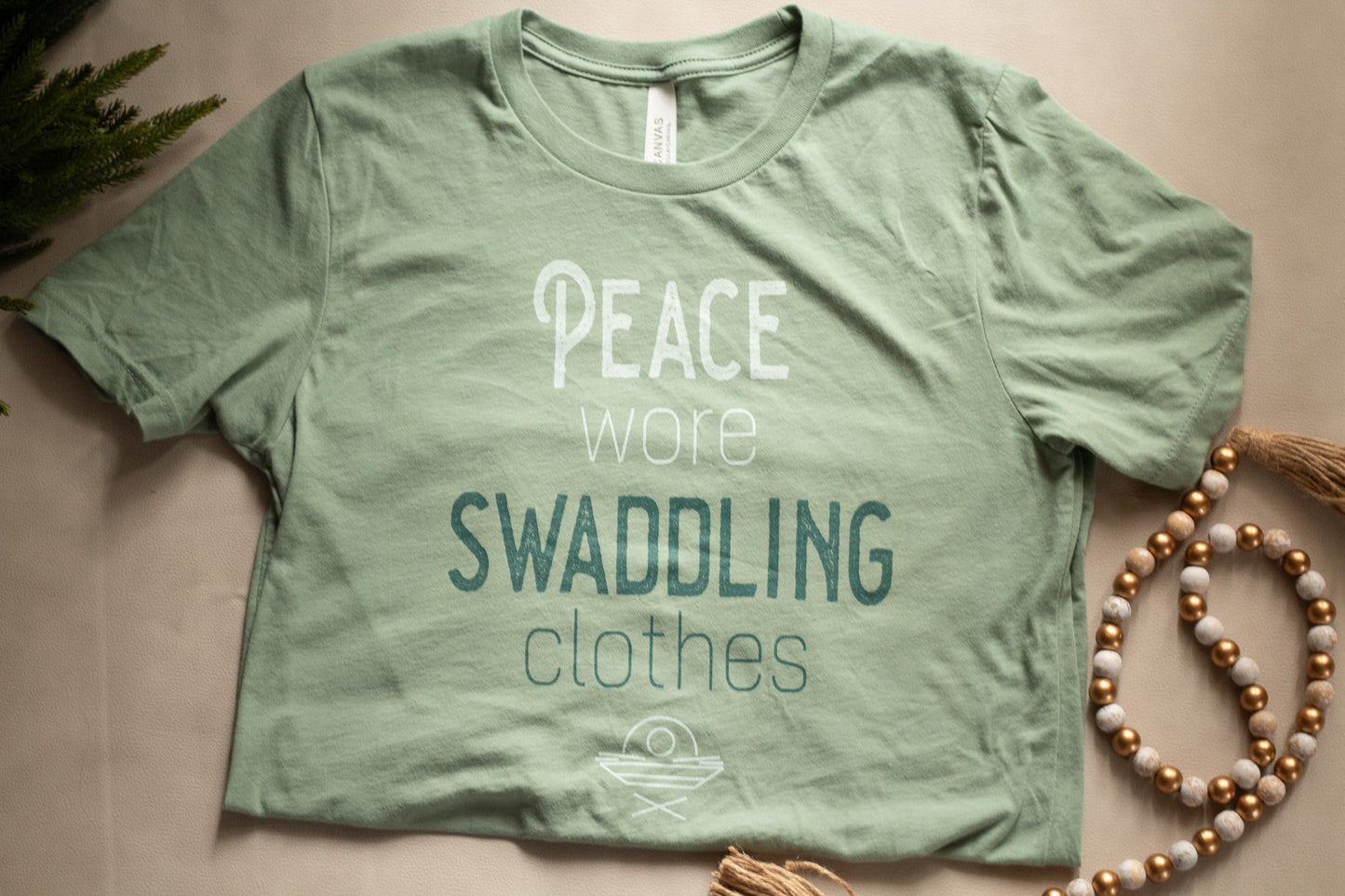 "Peace Wore Swaddling Clothes" - Christmas Tee Shirt for Christian Women